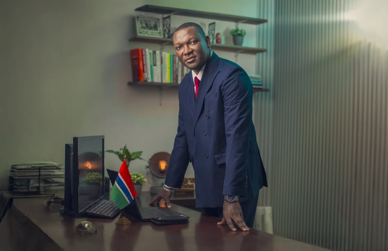 Navy suit, at the desk of David Jeng