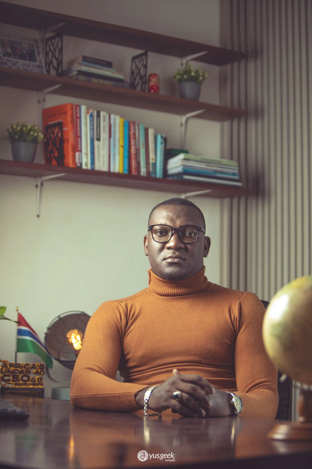 Orange turtleneck, in the study of David Jeng
