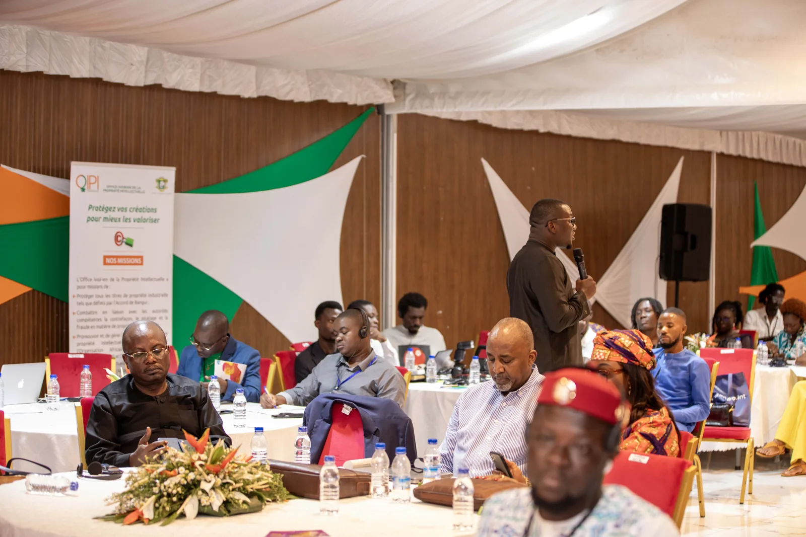 Audience members and a speaker at an event