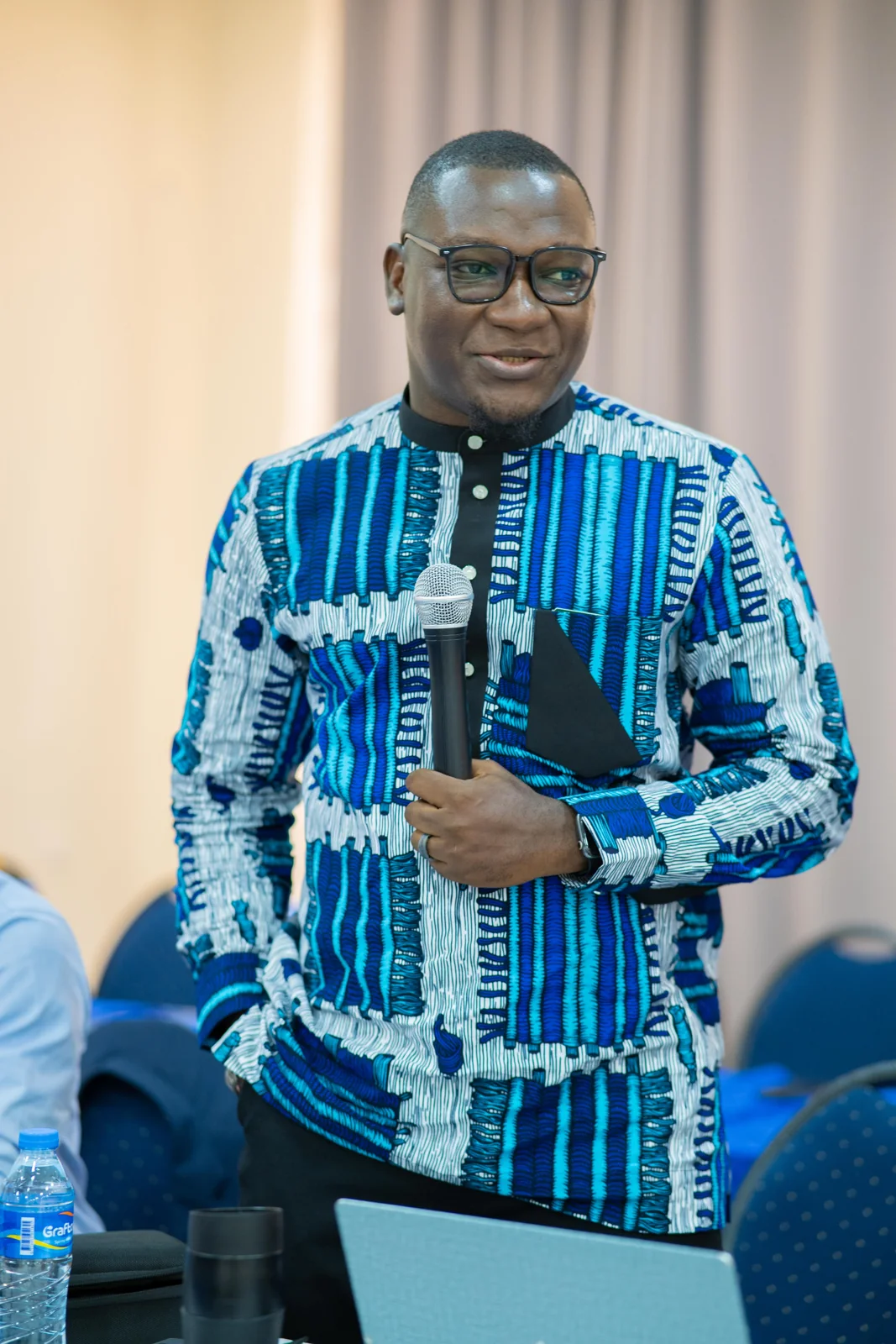 David Jeng standing with a microphone