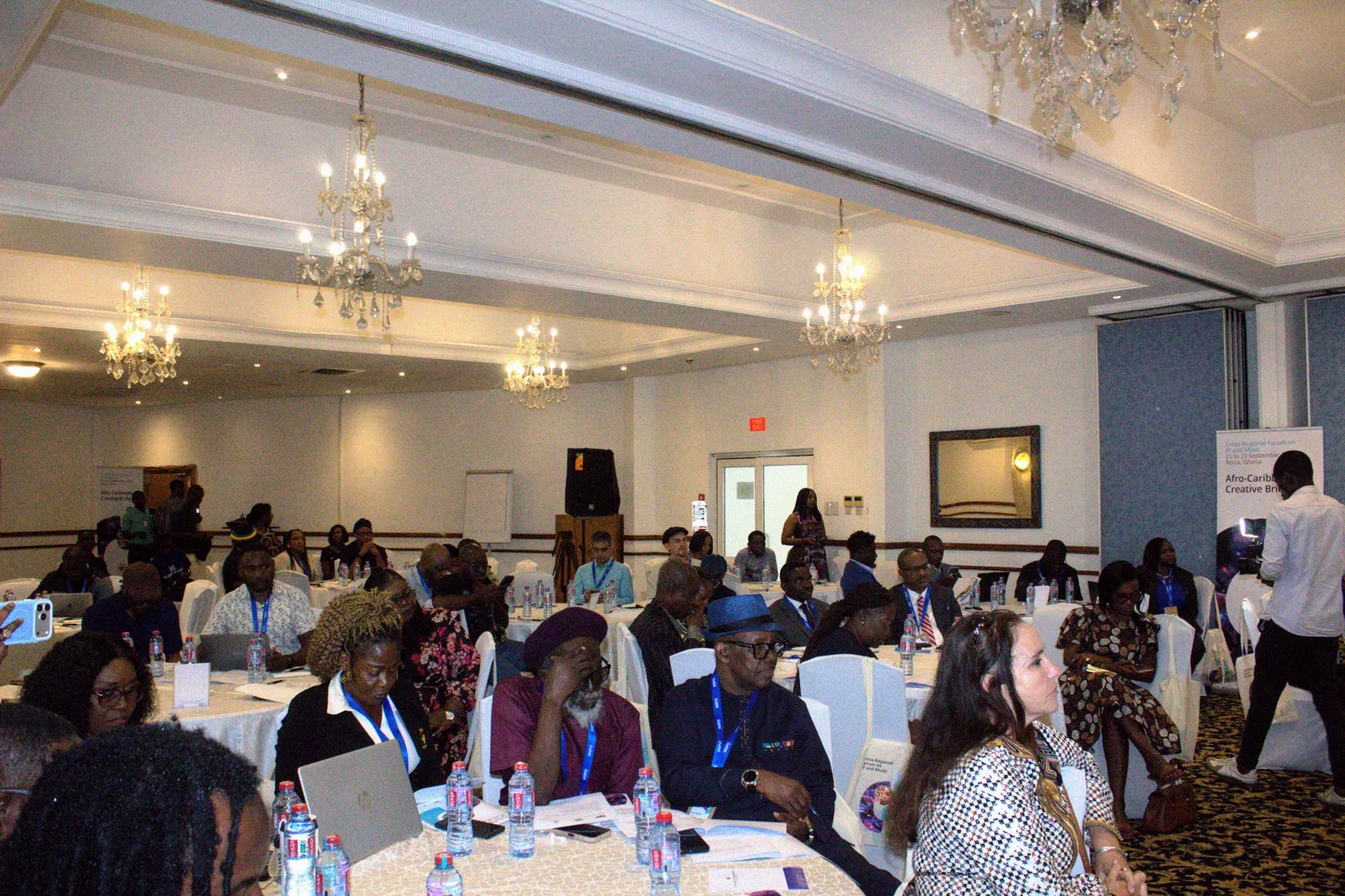 Audience members seated in the forum venue