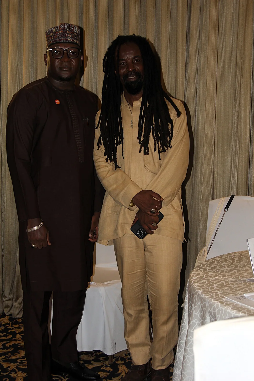 Two participants posing in the forum venue