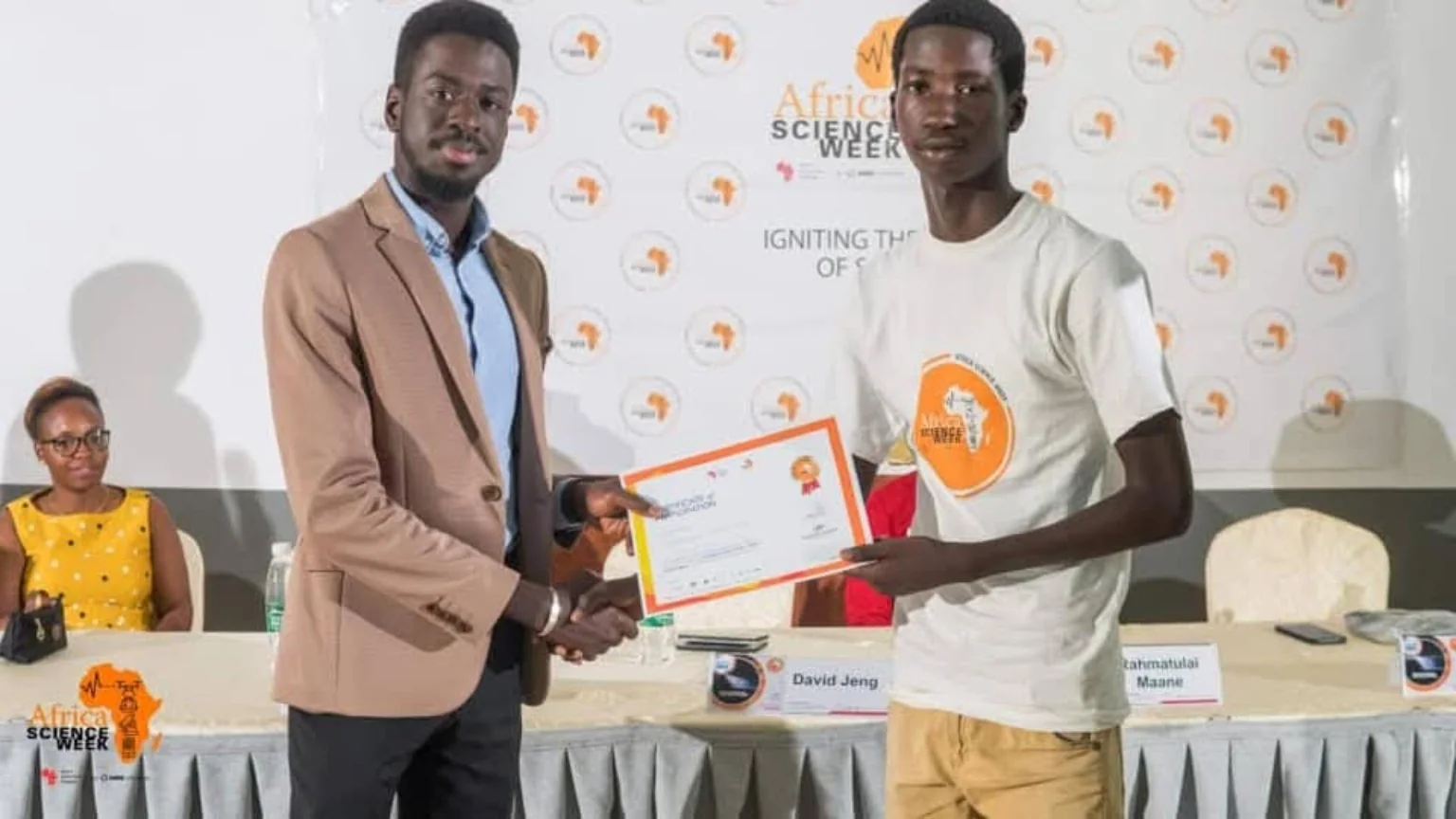 A participant receiving a certificate at Africa Science Week